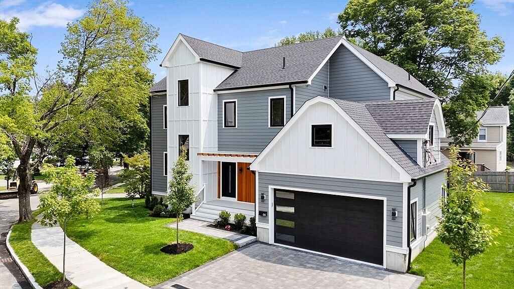 Exterior house painting on a gray two-story Massachusetts home with white trim