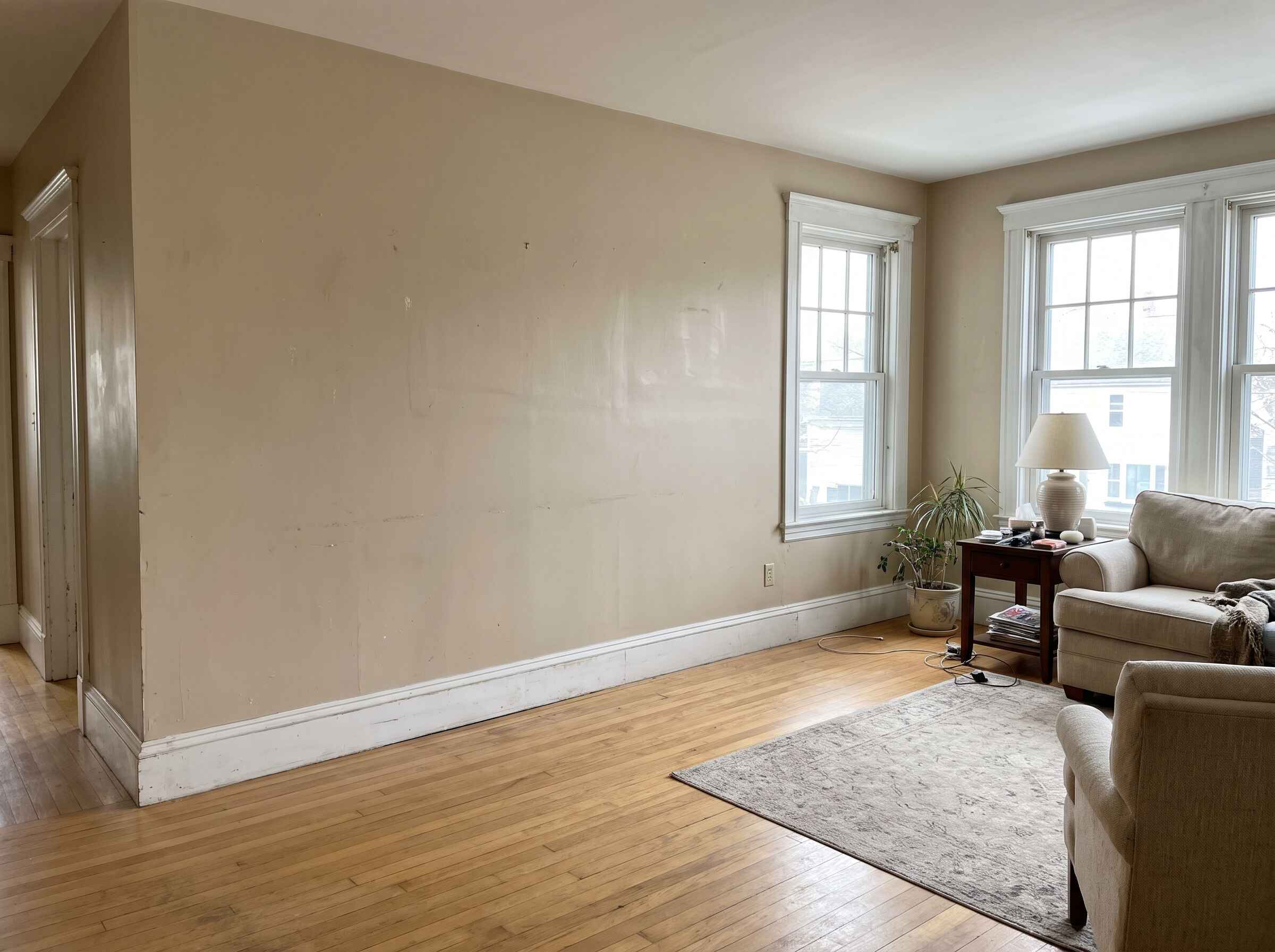 Living room with warm beige walls in a Massachusetts home, ready for a free painting estimate
